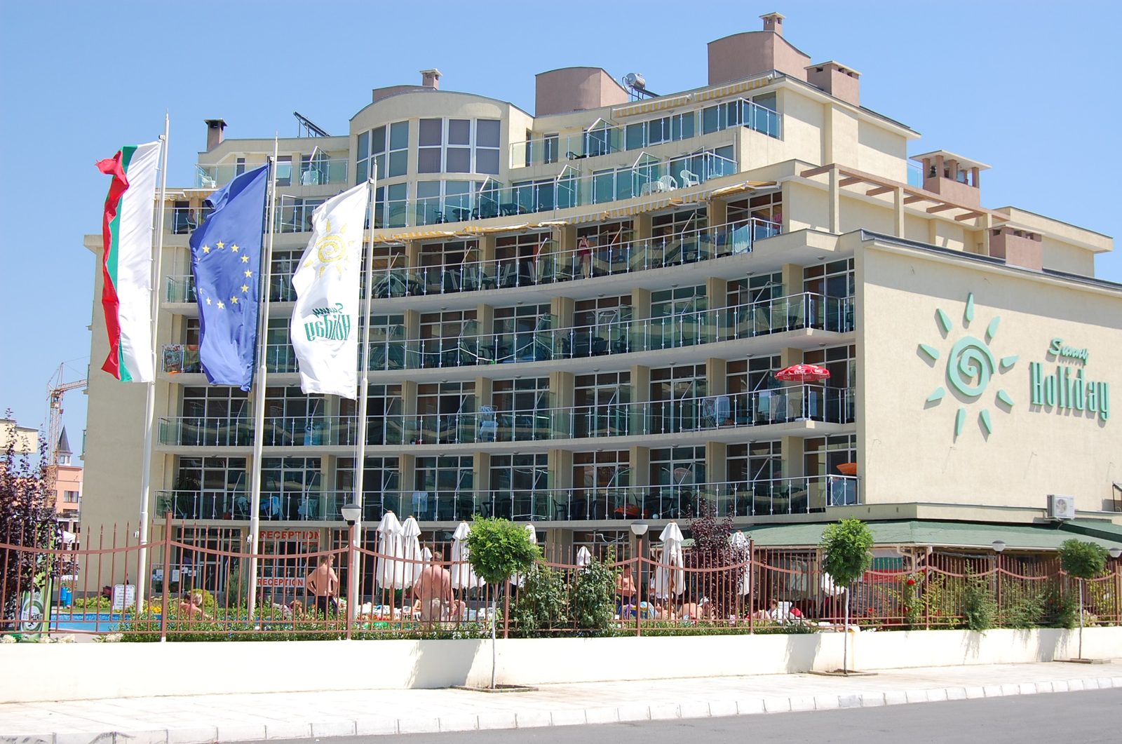 The building facade with the flags
